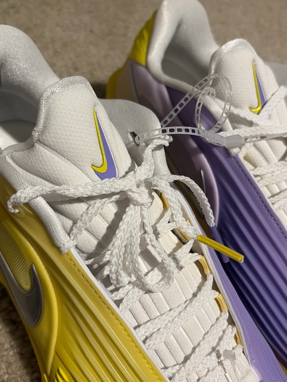 Nike Kids White Sneakers with Yellow and Lavender Accents